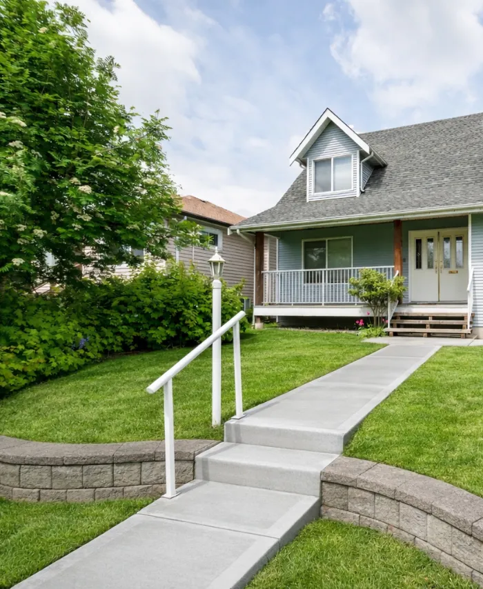 New concrete walkway installation project leading to residential home entrance in Dallas TX
